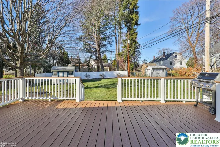 Spacious trex deck with natural gas grill.  Motion sensor floodlights,