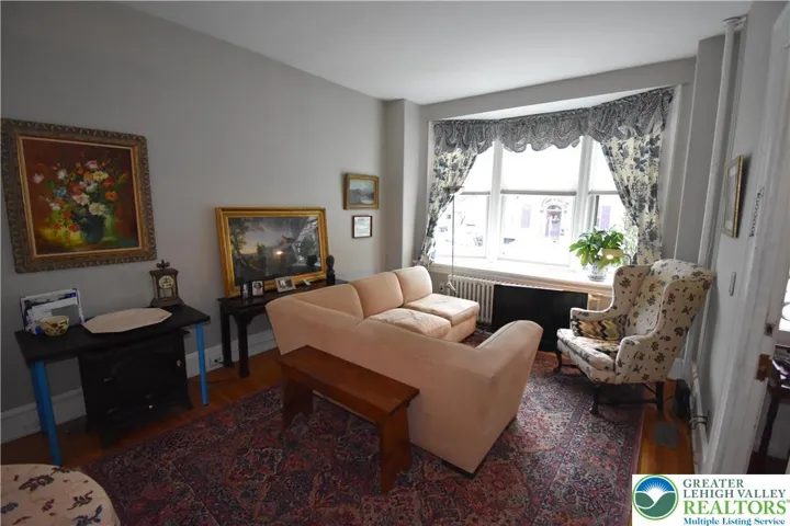 1st floor living room with bay window overlooking 3rd St.