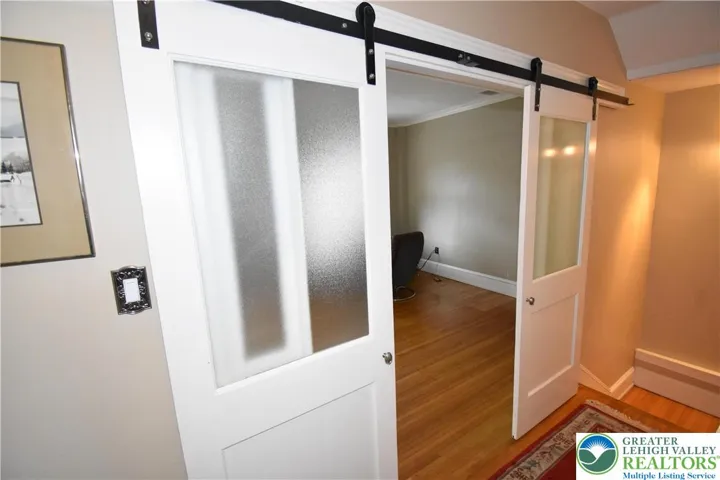 Glass barn doors entering living room of 2nd Floor Apt