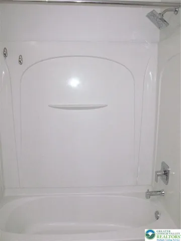 Shower in hallway full bathrm