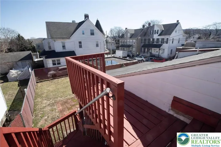 well maintained deck steps and full fenced in yard