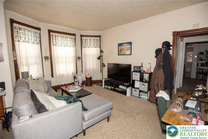 730 1st floor; large wood trim windows (perfect for ample natural lighting)