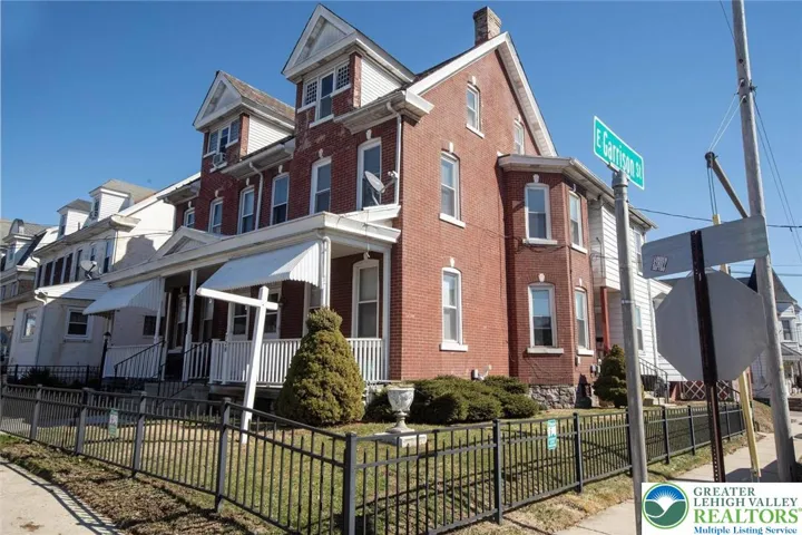 very nice curb appeal; well maintained perennial bushes/trees