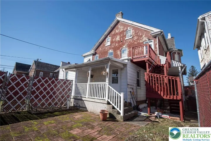view of back units with 2nd floor deck area for access out