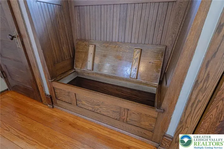 Storage seat and double closets in living room