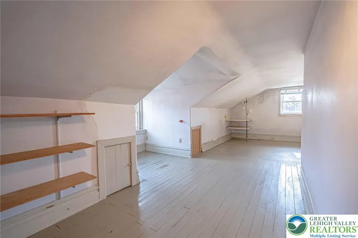 attic bedroom with walk in coset