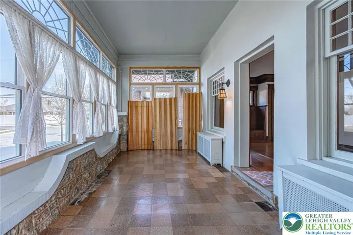 Sitting room/front enclosed porch