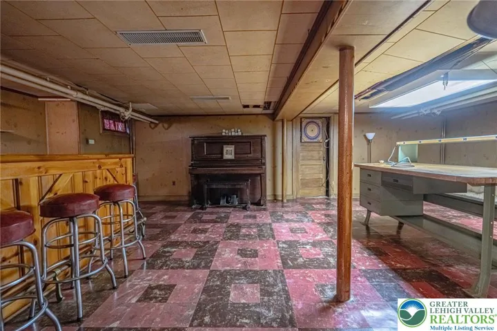 basement family room, vintage built in bar and vintage stools
