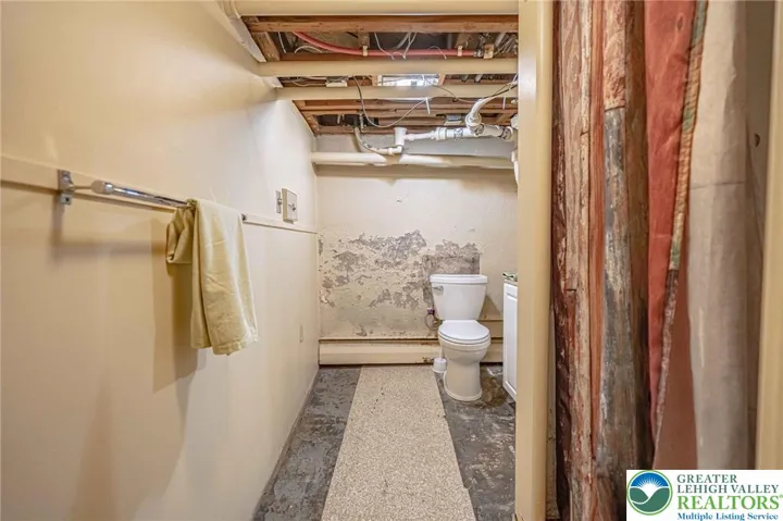 basement full bath in need of renovation