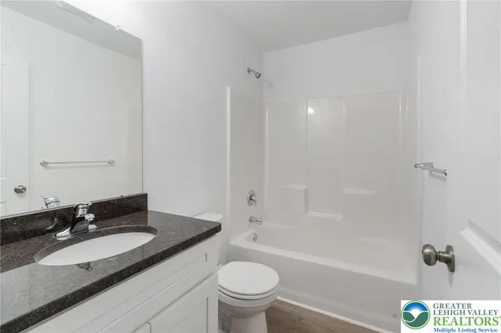 Model photos of townhomes. Second floor full bathroom.