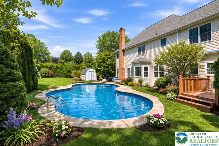 Enhanced "summer view" of the pool and backyard