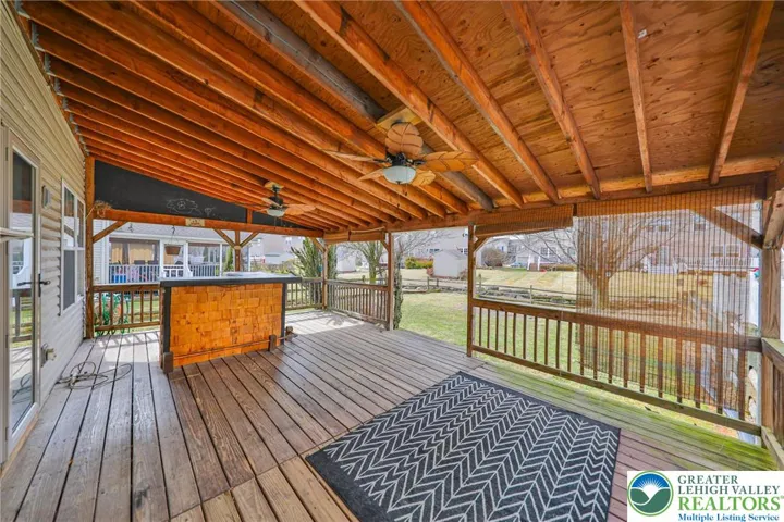 HUGE Deck with Ornate Ceiling Fans and Bar