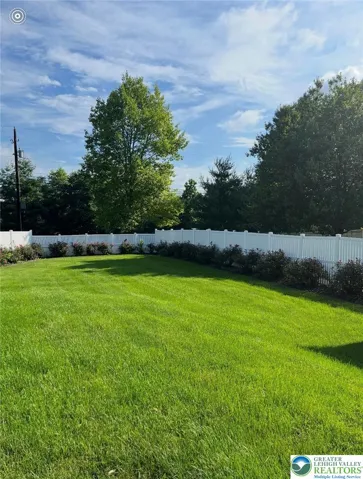 Large Fenced Yard beyond pool