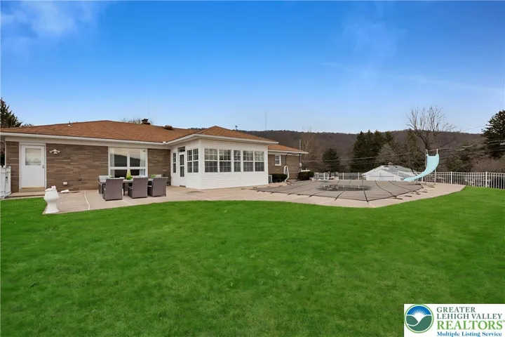 Patio virtually staged and grass digitally enhanced