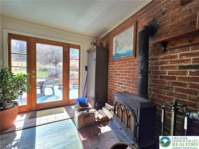 Triple atrium door-woodstove