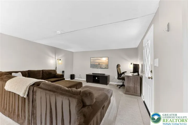 MASSIVE FINISHED BASEMENT WITH GORGEOUS STONE FIREPLACE AND WALKOUT