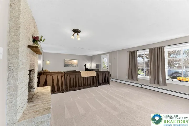 MASSIVE FINISHED BASEMENT WITH GORGEOUS STONE FIREPLACE AND WALKOUT