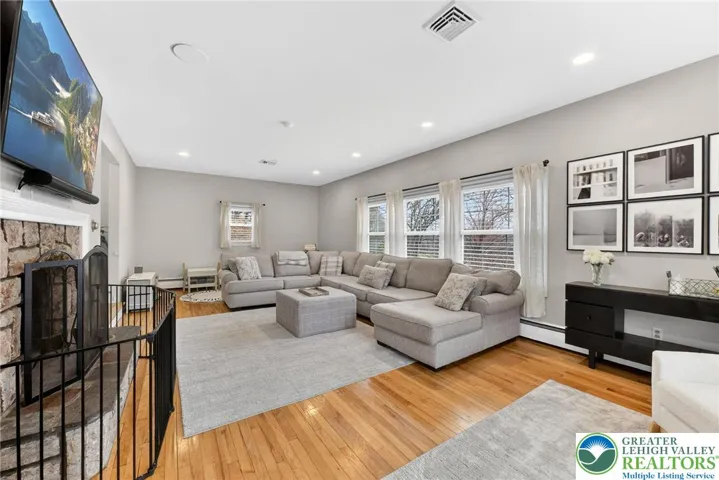LIVING ROOM WITH STONE FIREPLACE