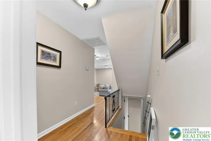 HALLWAY WITH HARDWOOD FLOORS!