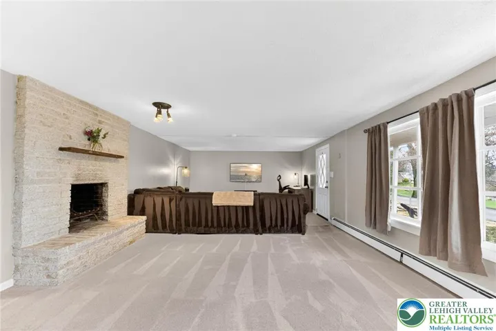 MASSIVE FINISHED BASEMENT WITH GORGEOUS STONE FIREPLACE AND WALKOUT