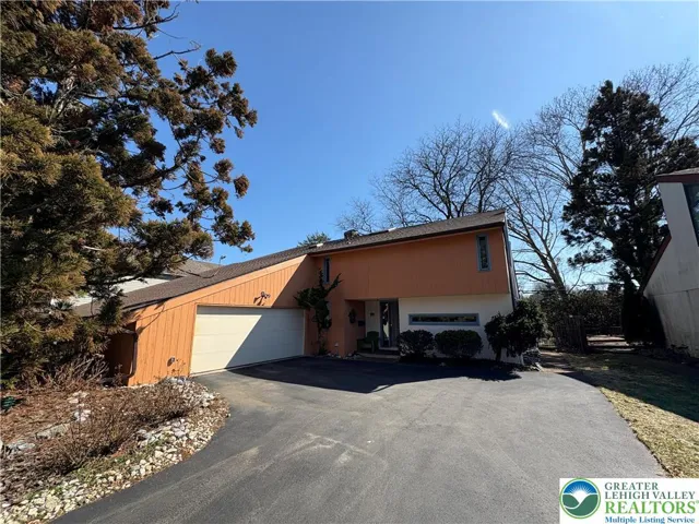 Front of property with driveway and on street parking only. Garage not included