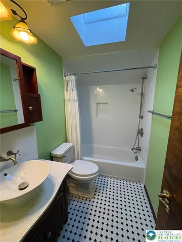 2nd floor full bathroom skylight tub