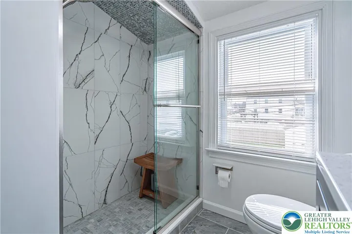 Oversized tile glass enclosure shower