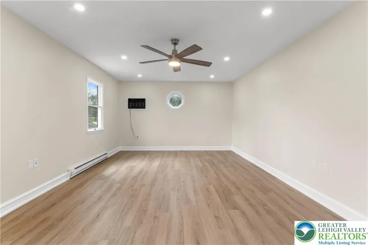 Primary bedroom- new electric baseboard heat
