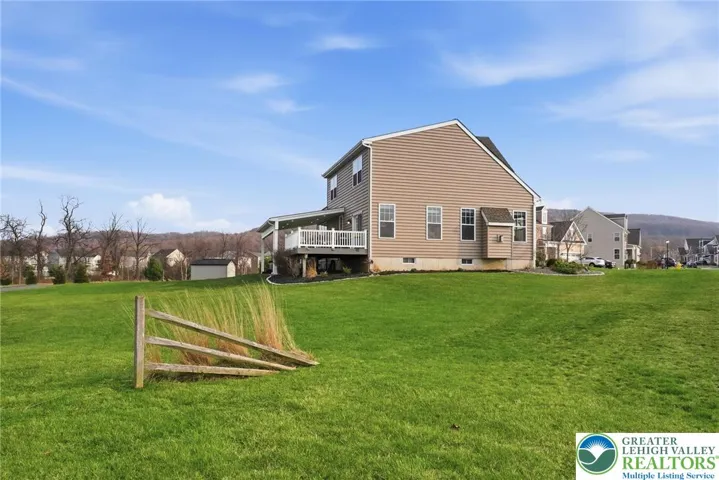 Private backyard with expansive stamped concrete patio