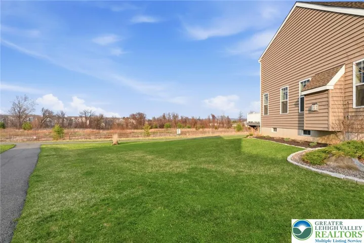 Private backyard with expansive stamped concrete patio