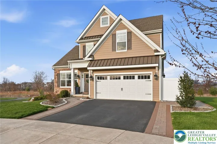 Welcoming front elevation with timeless design and upgraded exterior details