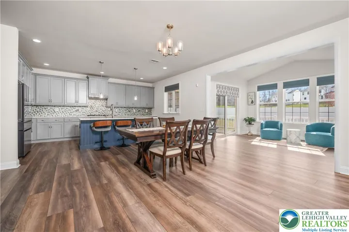 Looking from family room towards kitchen and sunroom