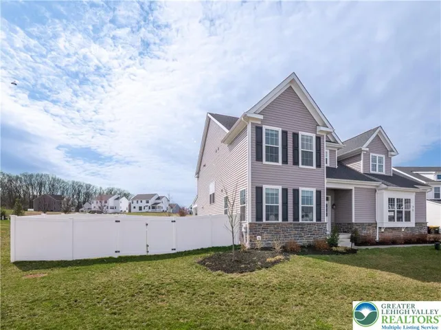 Side view of house and fence