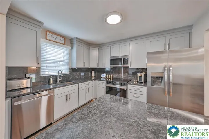 Granite Backsplash Spans the Entire Wall!