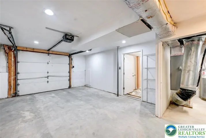 Spacious 1 Car Garage To Utility Room