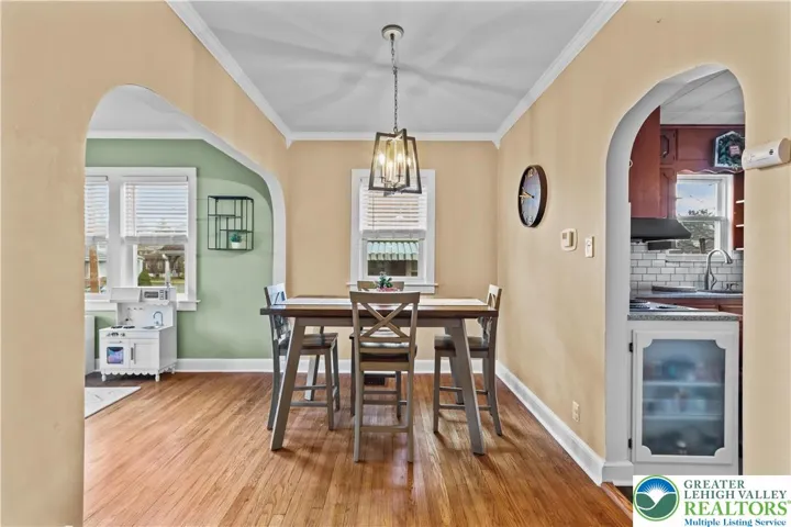 Dining Room Leads to Kitchen & Downstairs BR & Bath