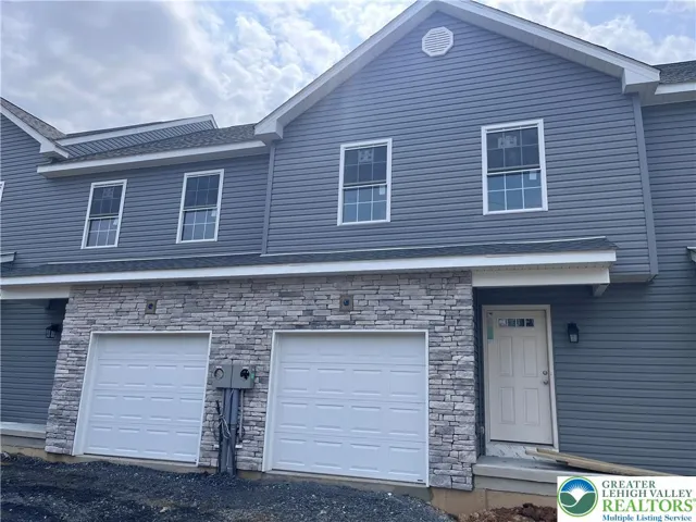 Stone veneer, attached garage.