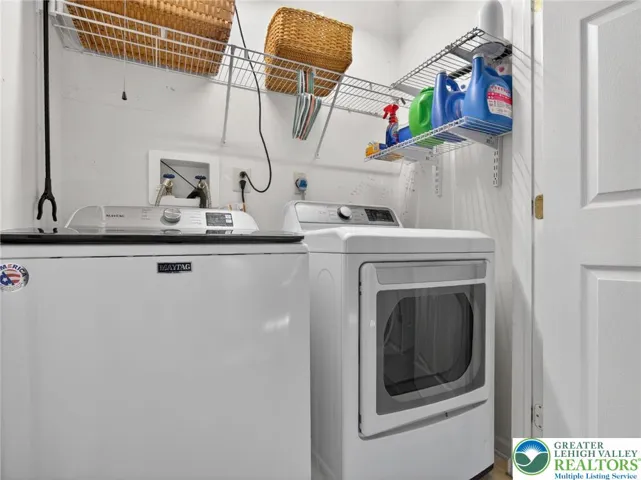 Efficient laundry space with storage on 2nd floor.