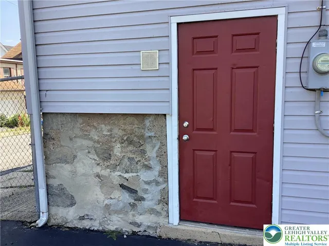 Side entrance to shop / storage space, exterior.