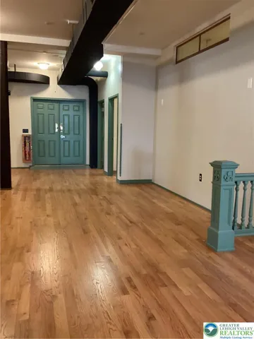 Towards rear private room and additional bathrooms.