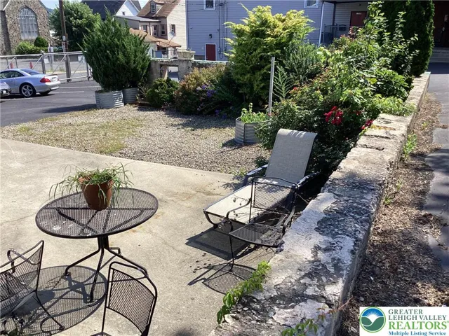 Lot / outdoor space toward parking and side door.