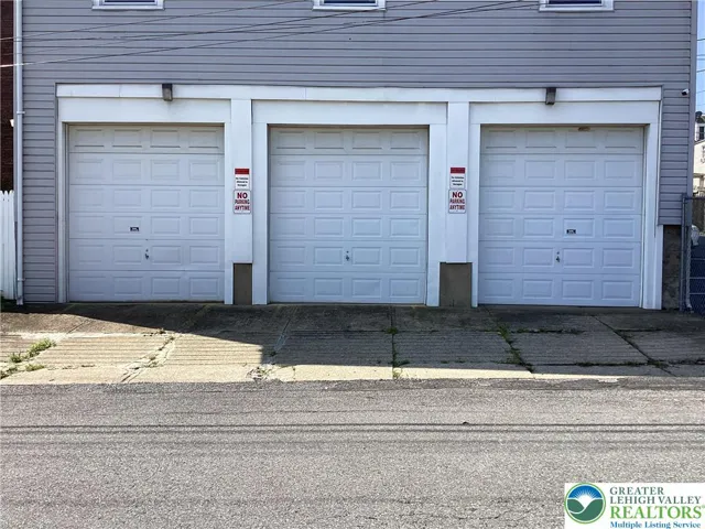 Overhead doors to storage / shop (NO parking.)