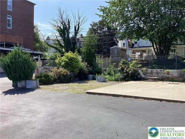 Lot / outdoor space toward building and rear covered patio.