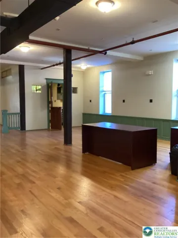 Adjoining kitchen space, toward its entrance.