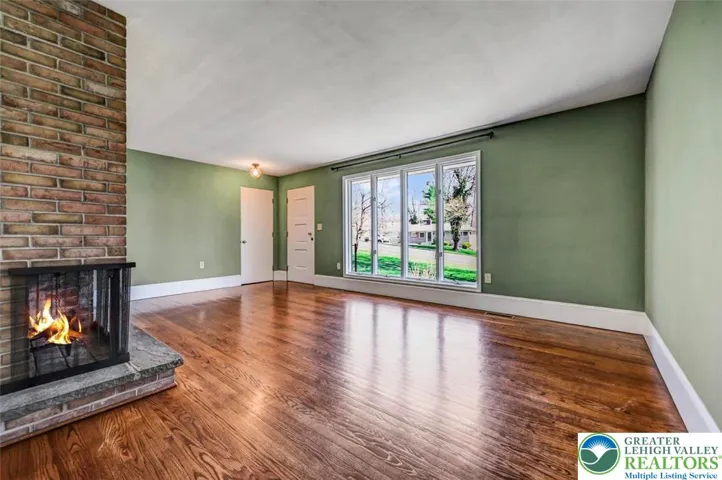 Living Room w/ Brick Fireplace