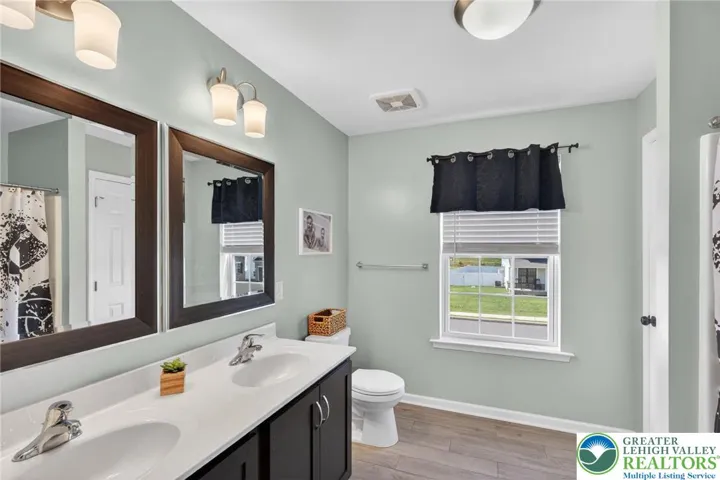 Main bath , linen closet, upgraded tile floor