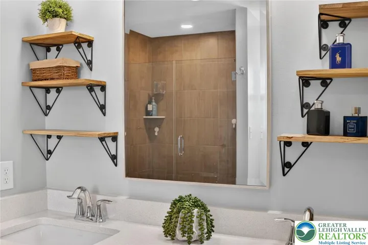 Upgraded floor to ceiling tiles, walk in, glass door