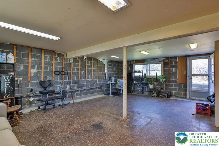 Familyroom lower level:Drywall and 2x4s to finish are included in sale