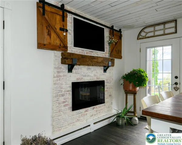 TV and fireplace offer ambiance and functionality