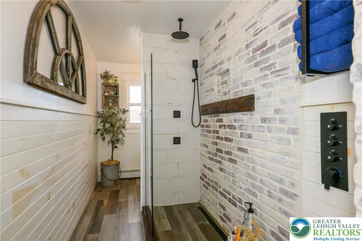 Spa-like rain-shower with body sprayers and handheld.